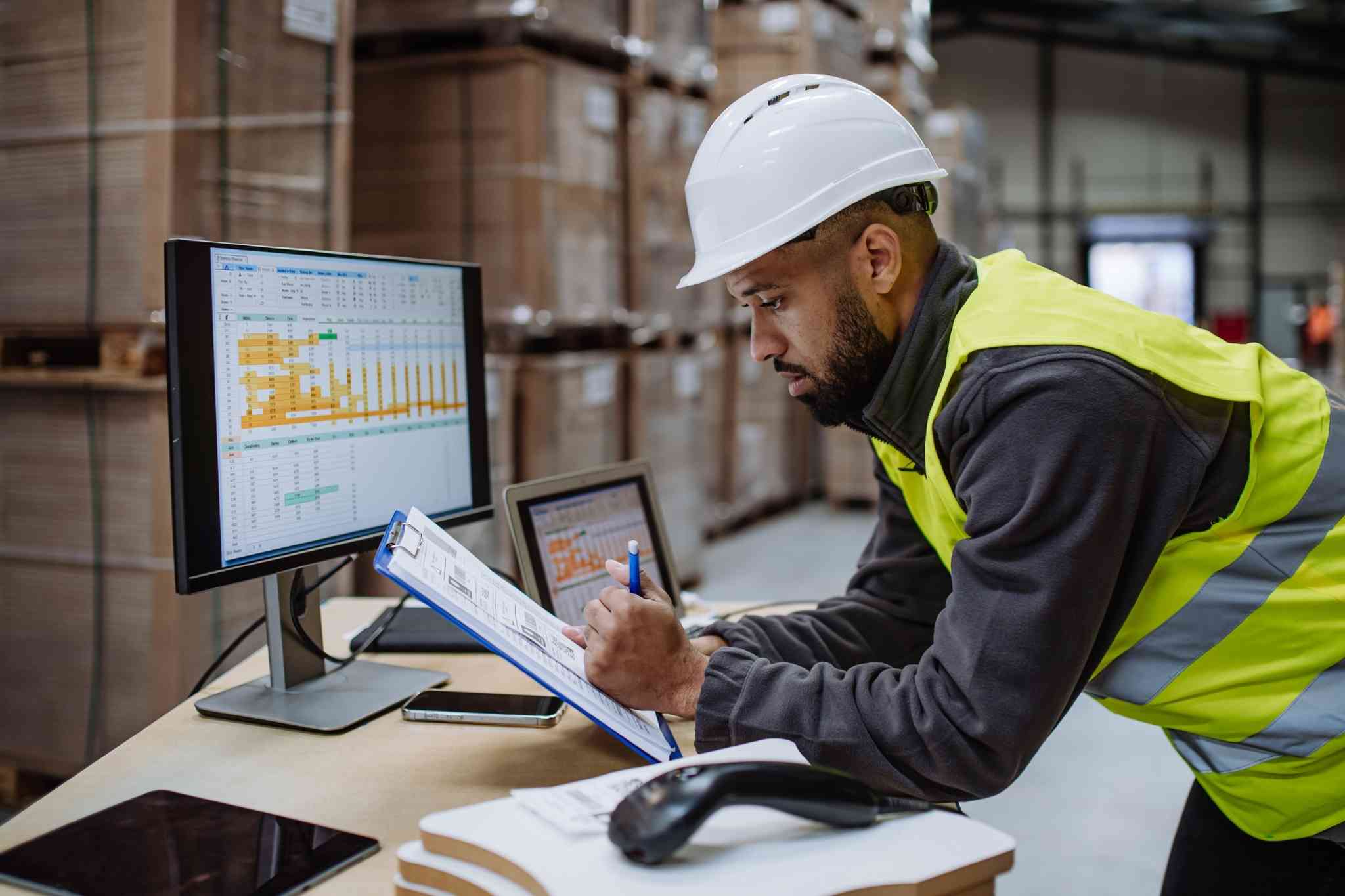 Warehouse personnel checking documents