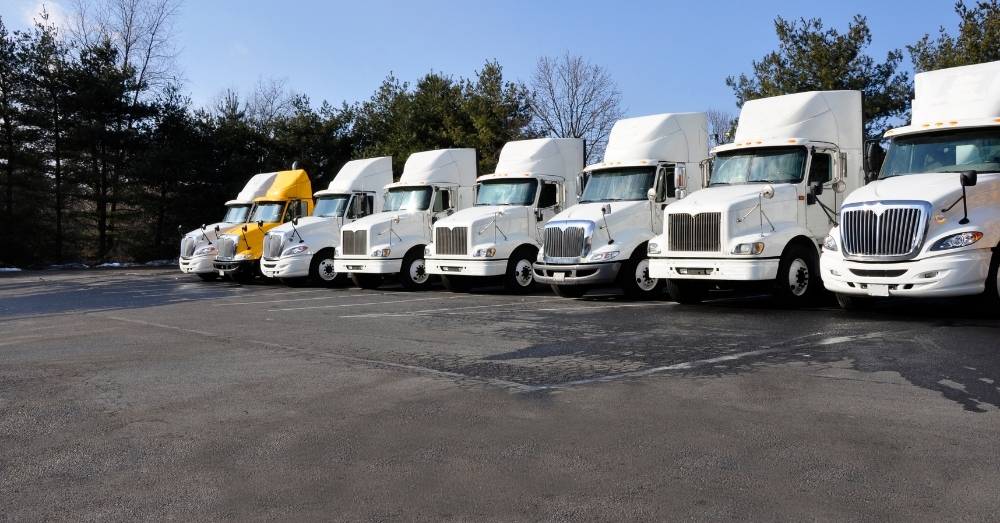 Fleet of semi-trucks for Conestoga Trailer hauling.